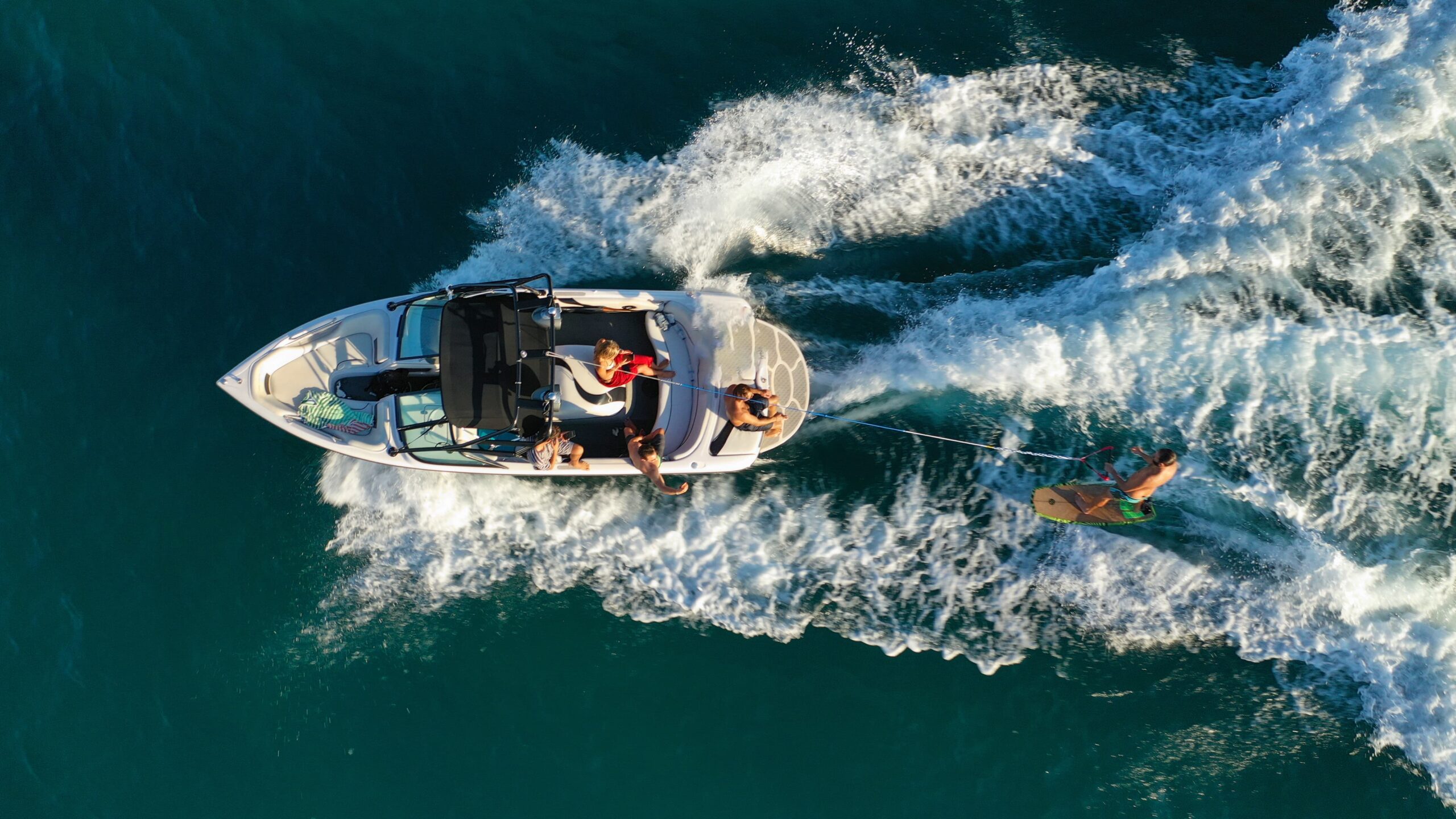 aerial view of a family enjoying lake life on Lake Perry with a boat rental from Rock Creek Marina